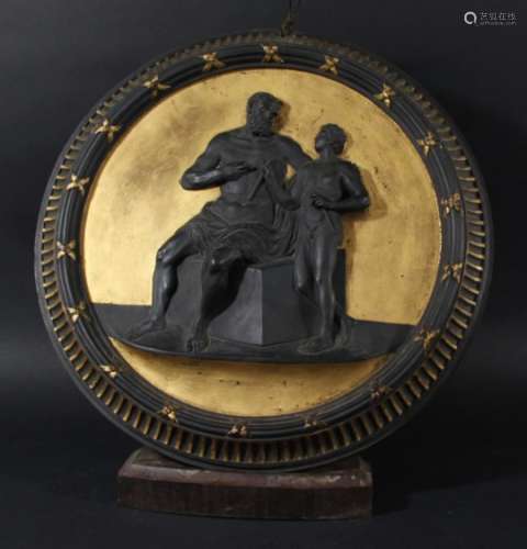 BLACK BASALT AND GILT CIRCULAR PLAQUE, 19th century, possibly Wedgwood, depicting a bearded,