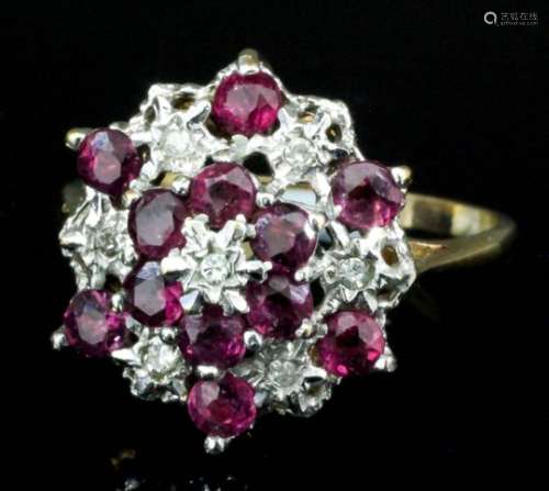 A modern 9ct gold mounted diamond and ruby cluster ring of flowerhead pattern, set with seven