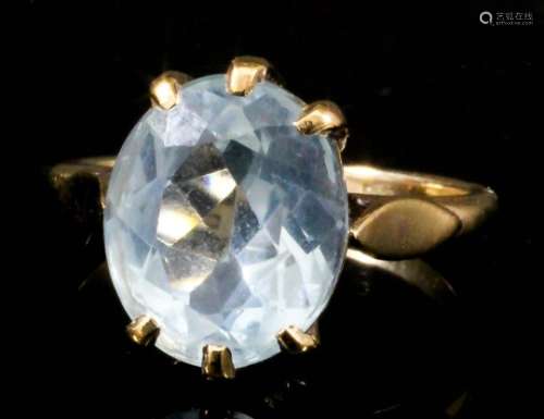 A modern 9ct gold mounted aquamarine oval ring, set with a facet cut aquamarine stone (approximate
