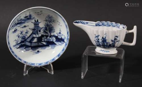 LOWESTOFT BUTTER BOAT, circa 1770, the reeded body blue painted with a chinoiserie pagoda scene,