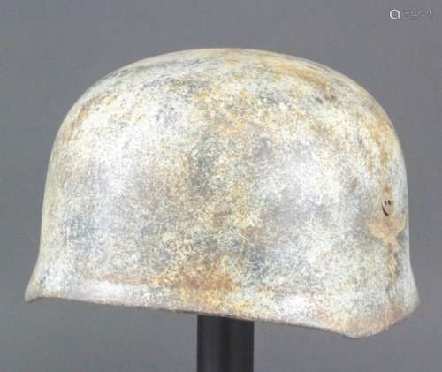 A World War II German Fallschirmjager double decal helmet, helmet bears the No. 788 to the inside