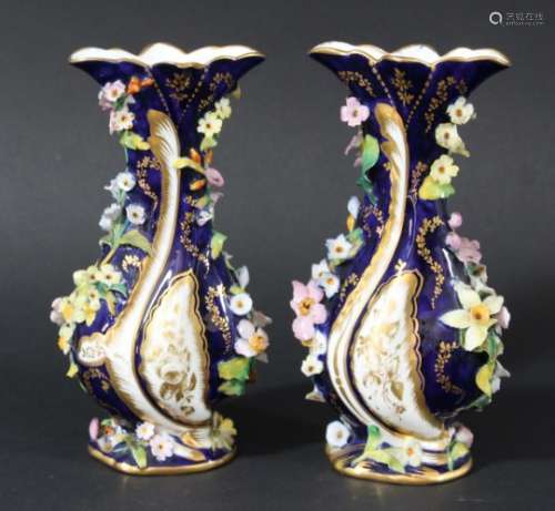 PAIR OF ENGLISH PORCELAIN FLORAL ENCRUSTED VASES, late 19th century, probably Minton, with a