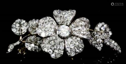 A late 19th / early 20th Century gold and silvery coloured metal mounted all diamond flowerhead