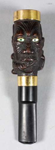 A late 19th/early 20th Century New Zealand hardwood and abalone cigar holder carved with a lizard