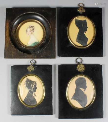 Three early Victorian oval shoulder length silhouettes with gilt highlights, 3.25ins x 2.5ins, in