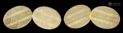 A pair of gentlemans 9ct gold oval cufflinks, the faces engraved with striped engine turned ornament