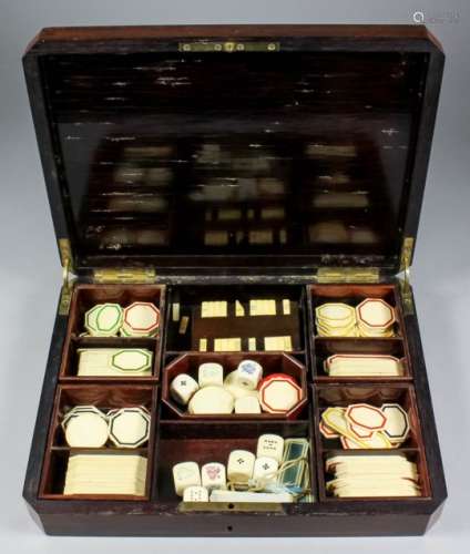 A late 19th Century Continental rosewood rectangular games box, with canted corners and brass inlay,