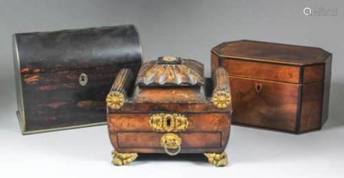 An early 19th Century brown leather covered jewellery box of sarcophagus shape, with pressed gilt