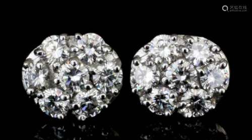 A modern pair of 18ct white gold mounted and diamond cluster earrings (for pierced ears) of