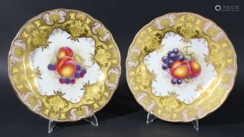 PAIR OF ROYAL WORCESTER PLATES, date code for 1957, by J Freeman, painted with fruit inside a yellow