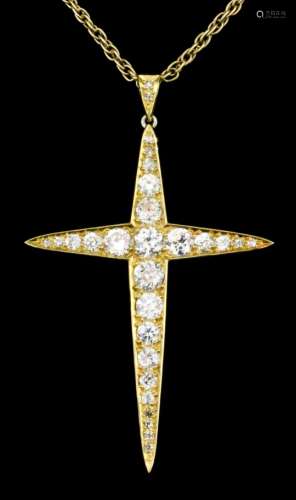 A modern 18ct gold mounted diamond set cross pendant, set with twenty-two graduated old cut and