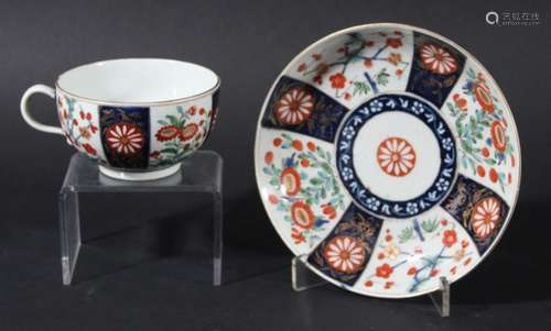 WORCESTER HANDLED TEA BOWL AND SAUCER, circa 1770, blue painted in the Queens pattern, saucer