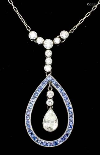 A modern 18ct white gold mounted diamond and aquamarine pendant, the tear drop shaped open loop