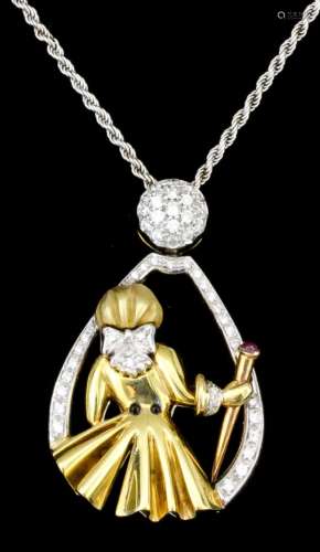 A modern 18ct yellow and white gold mounted diamond and ruby pendant in the form of the back of a