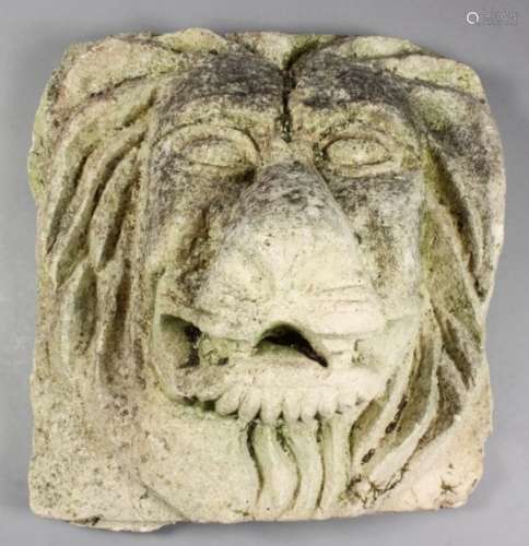 A moulded cement relief plaque of a lions head, 12.5ins x 14ins PLEASE NOTE THIS LOT IS BEING SOLD