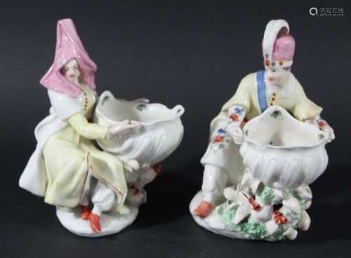 PAIR OF BOW FIGURAL SWEETMEATS OR SALTS, circa 1760-70, modelled as a Levantine couple, after a