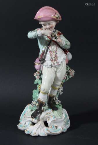 DERBY FIGURE OF A BOY, late 18th century, standing with a garland of flowers, on a pierced rococo