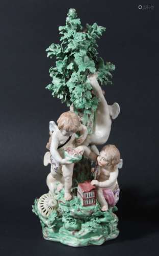 DERBY PATCH MARK FIGURE GROUP, late 18th century, modelled as four cherubs catching birds around a