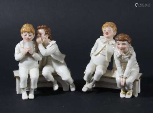 PAIR OF ROYAL WORCESTER GROUPS BY JAMES HADLEY, each modelled as two boys sat on a bench with a