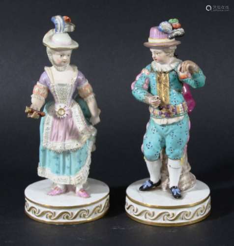PAIR OF MEISSEN FIGURES, 19th century, modelled as a young couple, on circular bases, blue crossed