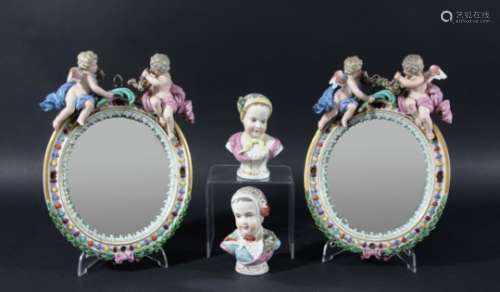 PAIR OF MEISSEN STYLE OVAL, PORCELAIN MIRRORS, with easel backs, surmounted by cherubs and flower