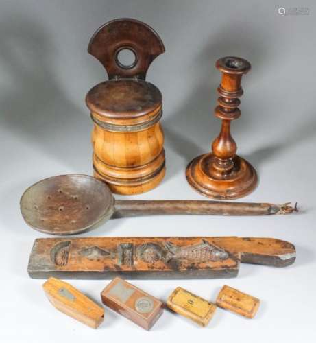 A turned olivewood candlestick of early 18th Century design, 9.25ins high, a turned wooden stave-