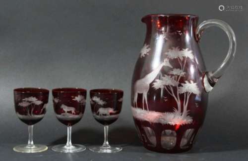 ROWLAND WARD EWER AND GLASS SET, red cut through to clear with various African safari animals,