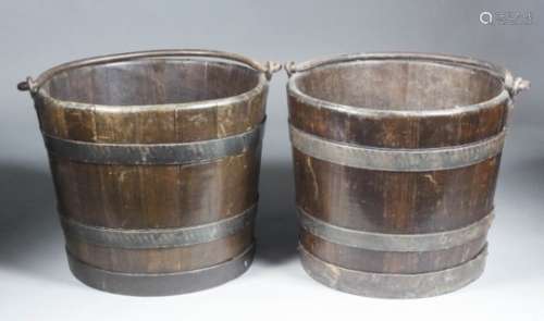 A pair of 19th/20th Century coopered oak and wrought iron bound buckets with wrought iron high swing