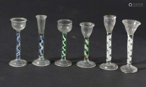 SET OF SIX MINIATURE ENAMEL TWIST WINE GLASSES, in the 18th century style, to include two blue and