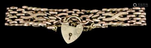 A 9ct gold gate bracelet with spiral twist and textured bars and with heart pattern padlock clasp (