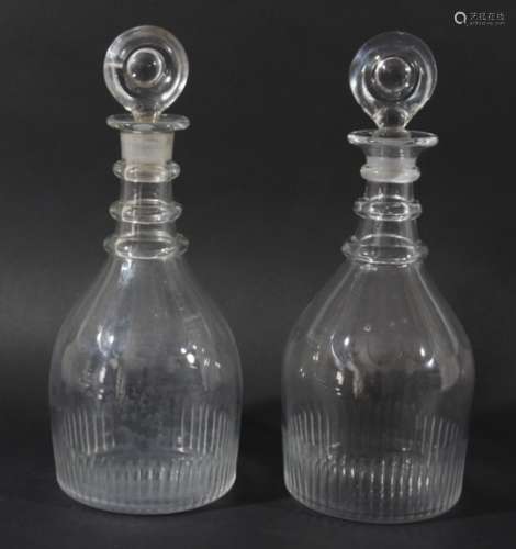 PAIR OF GEORGIAN GLASS DECANTERS AND STOPPERS, of mallet form with three ring necks, bulls eye