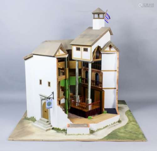 A card, wood, straw and painted model of the Tudor Globe Theatre, the walls partially cut away to
