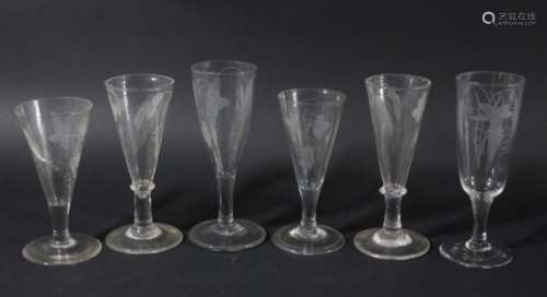 GROUP OF SIX ALE GLASSES, late 18th or early 19th century, the drawn trumpet bowls engraved with