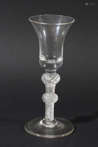 GEORGIAN WINE GLASS, the bell shaped bowl above a multiple spiral air twist stem with shoulder and
