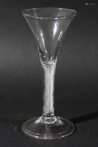 GEORGIAN WINE GLASS, the trumpet shaped bowl above a multiple spiral air twist stem and folded foot,