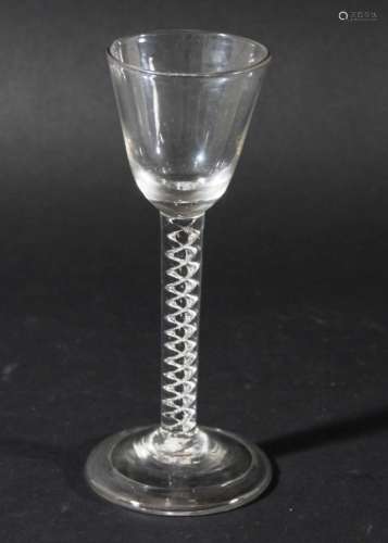 GEORGIAN WINE GLASS, the rounded funnel bowl above a single series air twist stem of two spiral