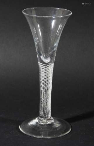 GEORGIAN WINE GLASS, the trumpet shaped bowl above a multiple spiral air twist stem and spreading