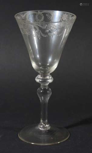 18TH CENTURY LIGHT BALUSTER WINE GLASS, the rounded funnel shaped bowl engraved with slylised floral