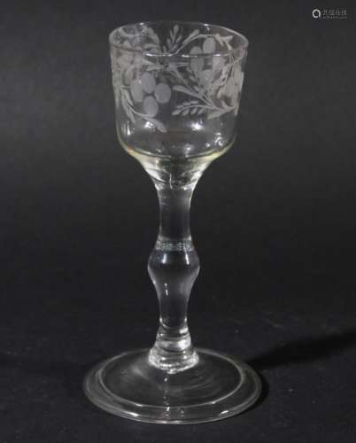 WINE GLASS, circa 1760, the ogee bowl with floral engraving, the balustroid stem with a central knop