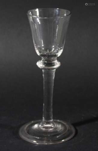 WINE GLASS, circa 1750, the rounded bowl above a balustroid stem with flattened shoulder knop and