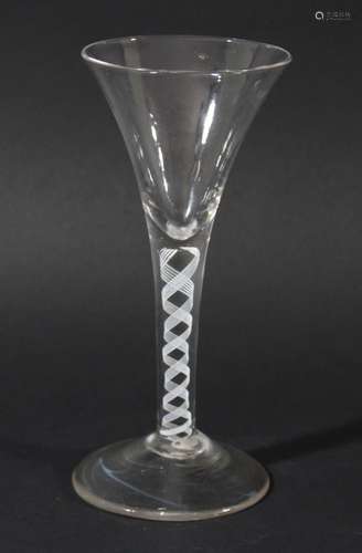 WINE GLASS, circa 1760, the drawn trumpet bowl above a single series opaque twist stem with a pair