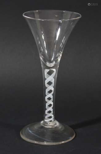 WINE GLASS, circa 1760, the drawn trumpet bowl above a single series opaque twist stem with a pair