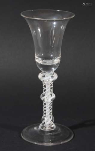 WINE GLASS, circa 1760, the bell bowl with a solid base on a double series opaque twist stem with