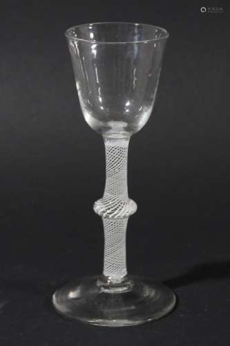 WINE GLASS, circa 1760, the rounded bowl on a multiple spiral opaque twist stem with a central knop,