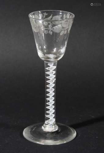 WINE GLASS, circa 1760, the rounded bowl with a band of floral engraving on a single series opaque