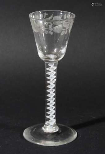 WINE GLASS, circa 1760, the rounded bowl with a band of floral engraving on a single series opaque