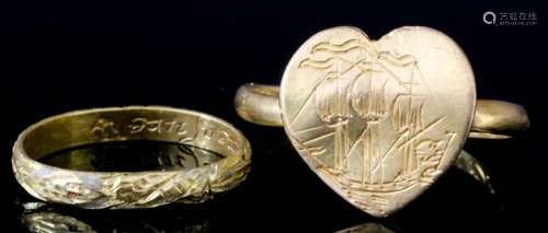 A 16th/17th Century gold coloured metal posy ring, the heart shaped face engraved with a ship, the