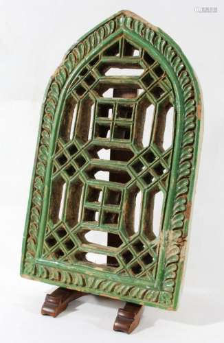 NORTH INDIAN TERRACOTTA JALI WINDOW, perhaps 17th century, with a green glaze, 40cm x 24.5cm