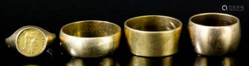 Three 9ct gold plain wedding bands, and one other 9ct gold ring inset with a French 1865 gold