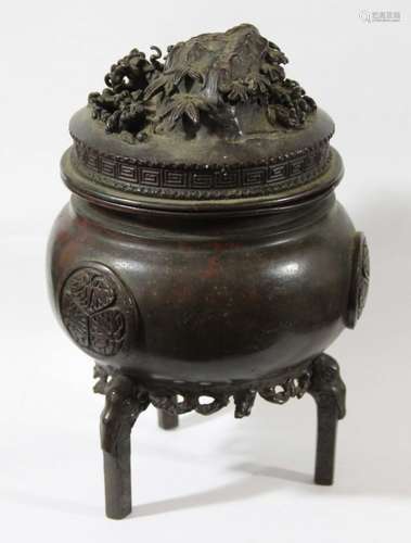 JAPANESE BRONZE CENSER AND COVER, Meiji, of tripod, ovoid form applied with foliate roundels on